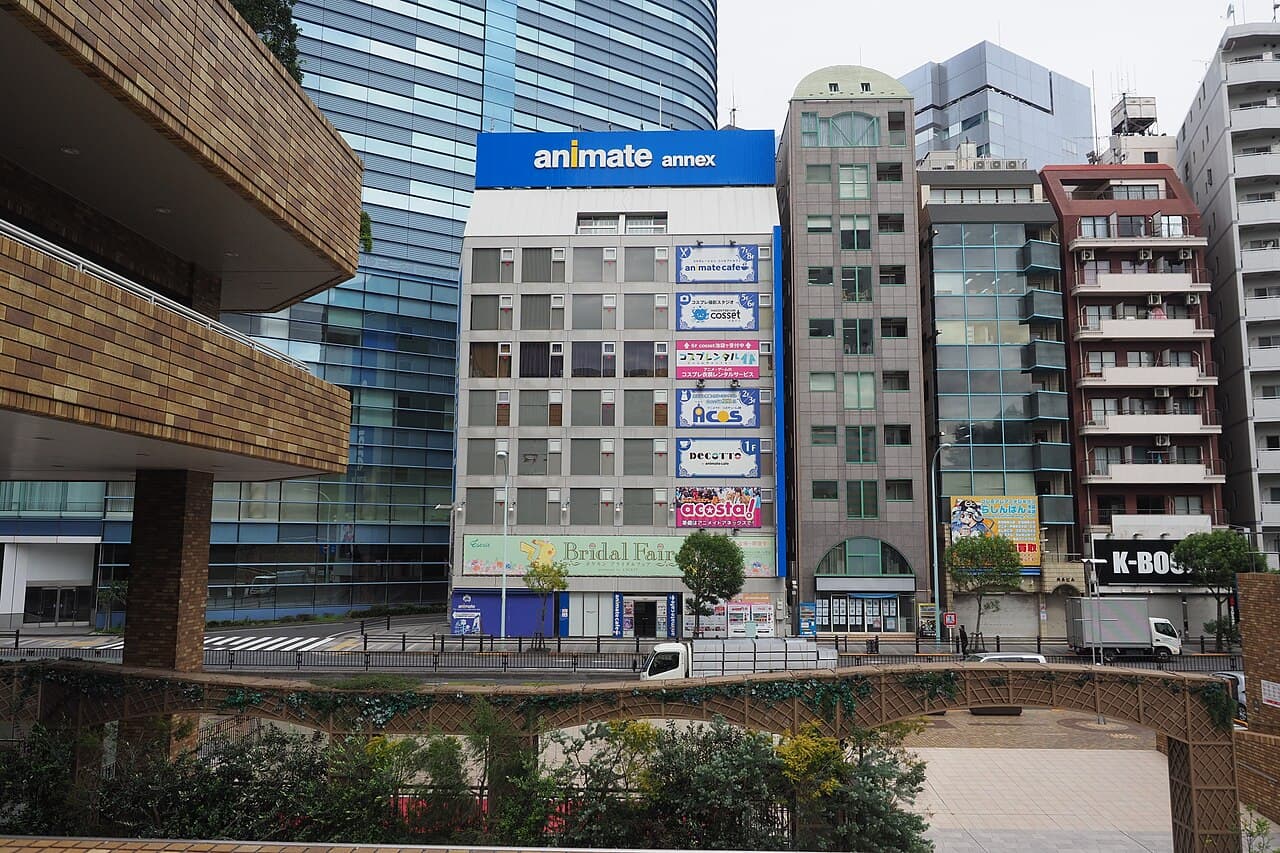 Street-level view of Animate Annex and the Lashinbang Ikebukuro Main Store storefronts in Ikebukuro, Tokyo