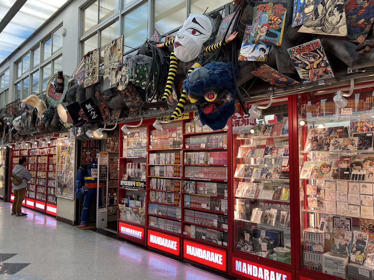 Mandarake main store with illuminated red signage inside Nakano Broadway