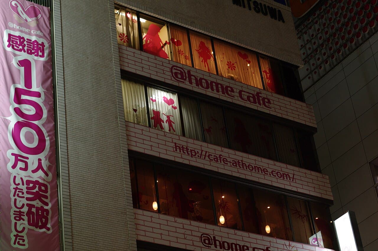 @home cafe signs on the Mitsuwa Building in Akihabara, Tokyo, at night (photo taken in 2010)