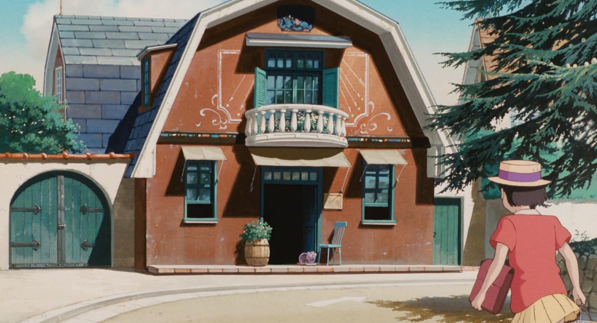 『耳をすませば』で、緑の鎧戸とバルコニーのあるオレンジ色の壁の骨董店「地球屋」へ向かう雫